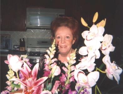 Ronda in her Kitchen with Flower Arrangement